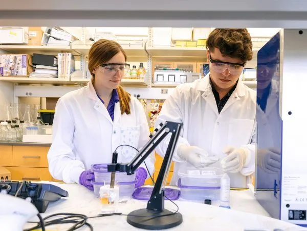 two chemistry students working in niagara's lab