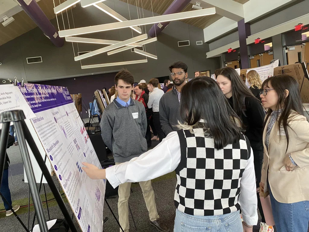 mba students presenting at an event