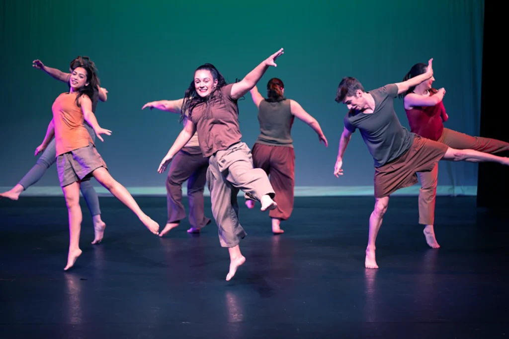 group of students dancing on stage